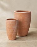 Belize weathered terracotta tall bowl planters in two coordinated sizes.