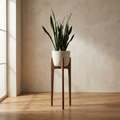 Ada Walnut Stand solid walnut tripod plant stand with bone ceramic planter and snake plant