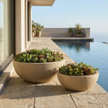 CONCEPT IMAGERY — Basin Bowl Pair concept, two sand-washed cast concrete low bowls at pool edge