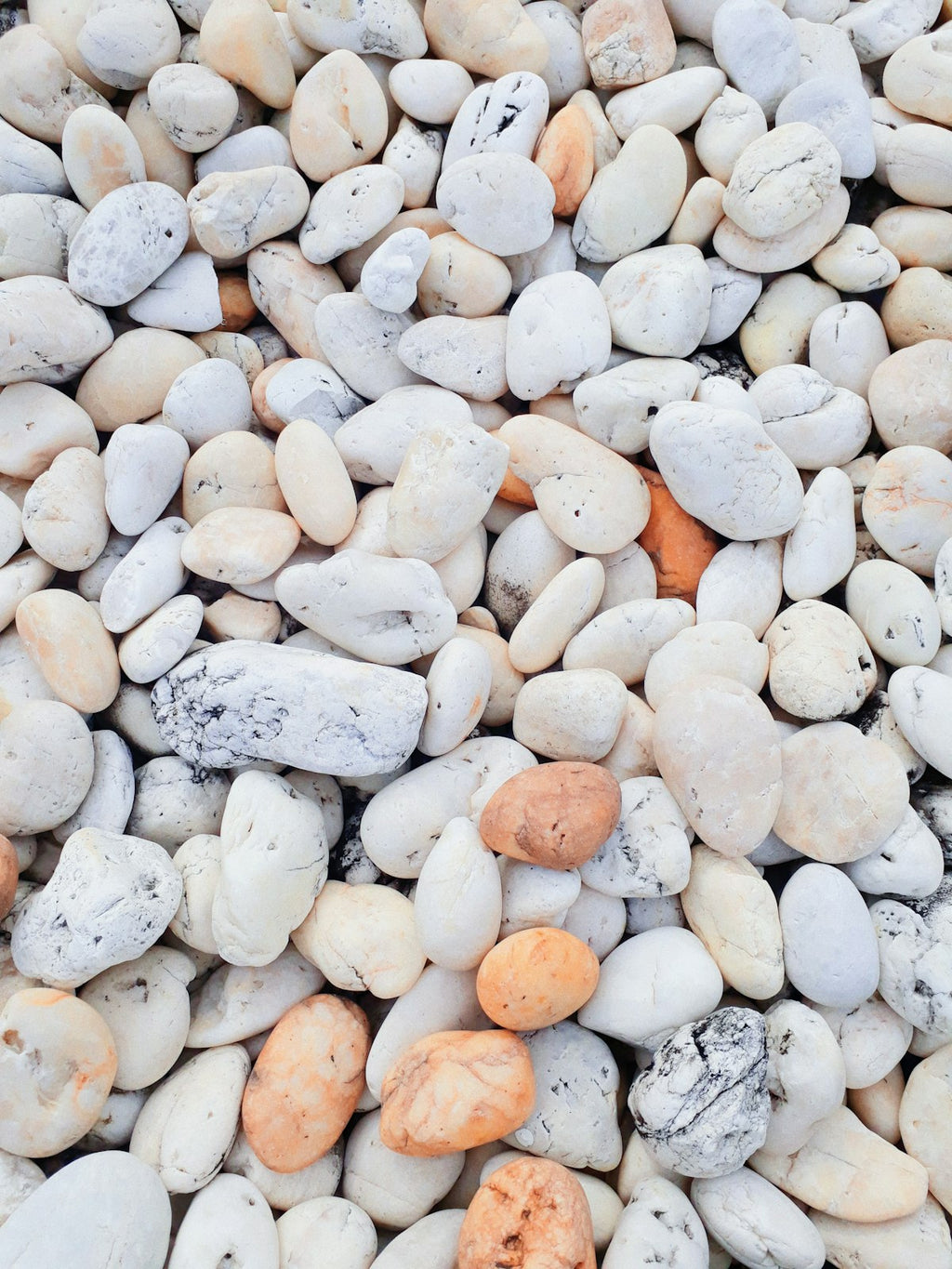 Natural white and cream stones arranged in a decorative display