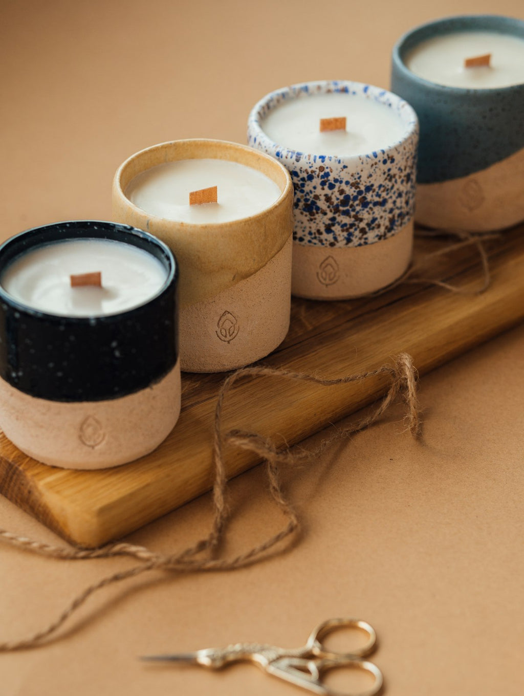 Minimal soy candle in ceramic vessel with warm ambient light