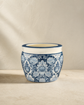 Blue-and-white floral Arboretum cachepot on pale limestone.