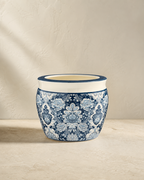 Blue-and-white floral Arboretum cachepot on pale limestone.
