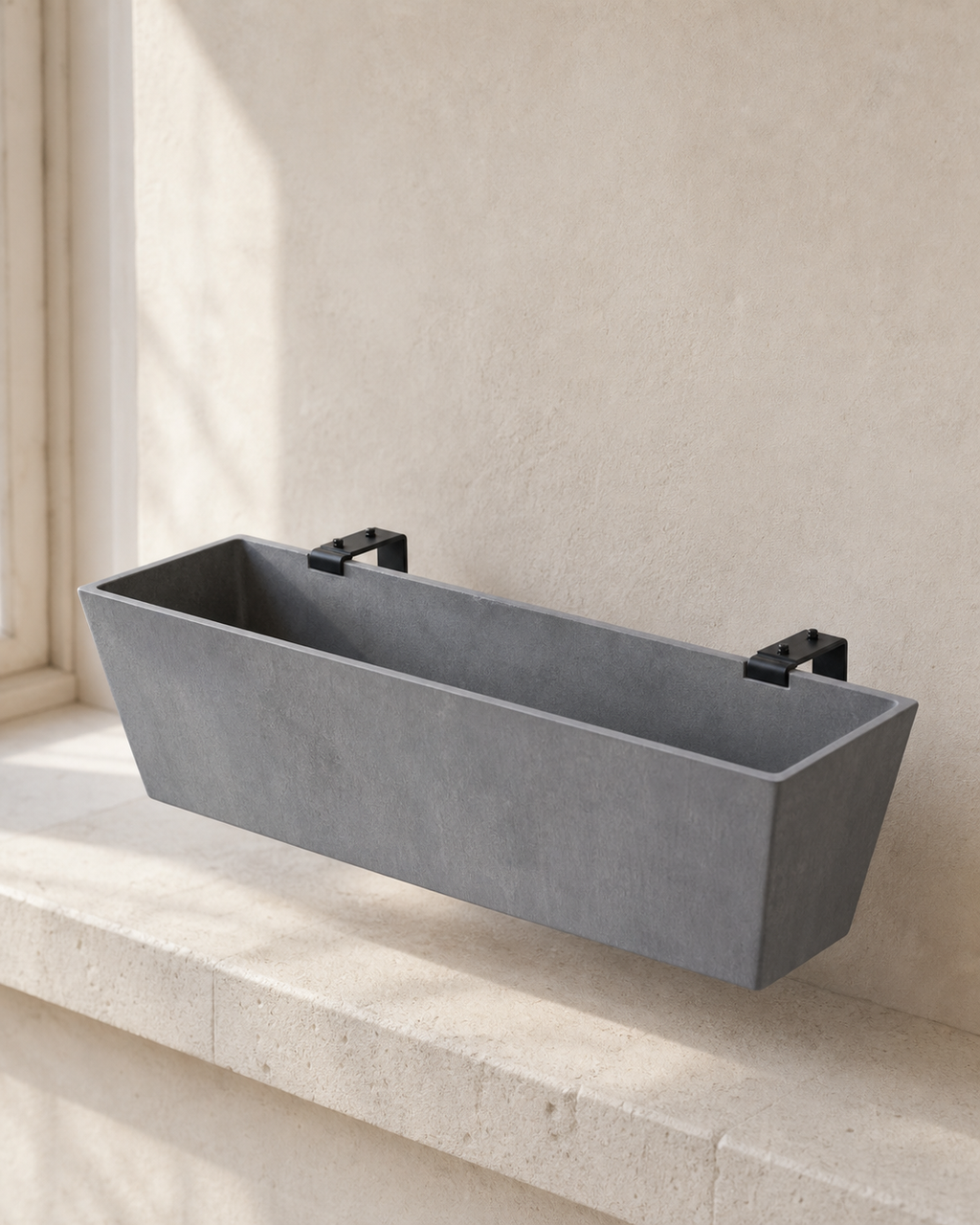 Charcoal Hevea window box planter with two black mounting brackets.