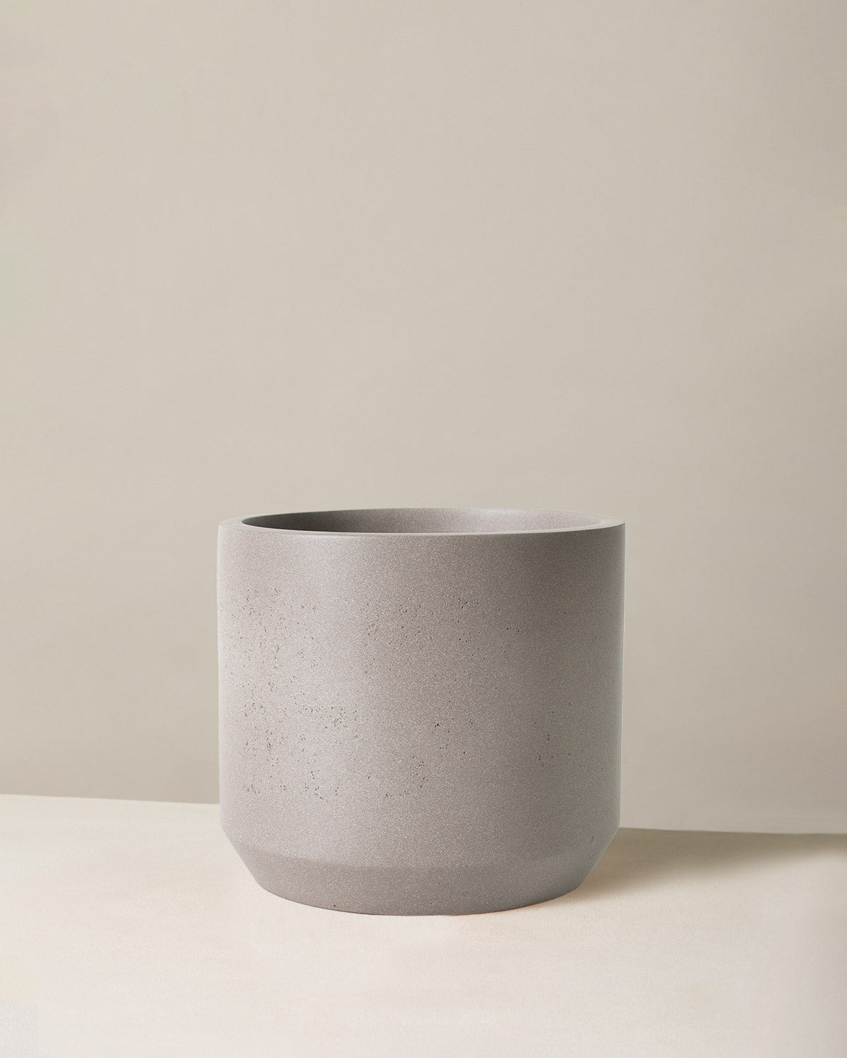 Gray textured plant pot on a neutral background